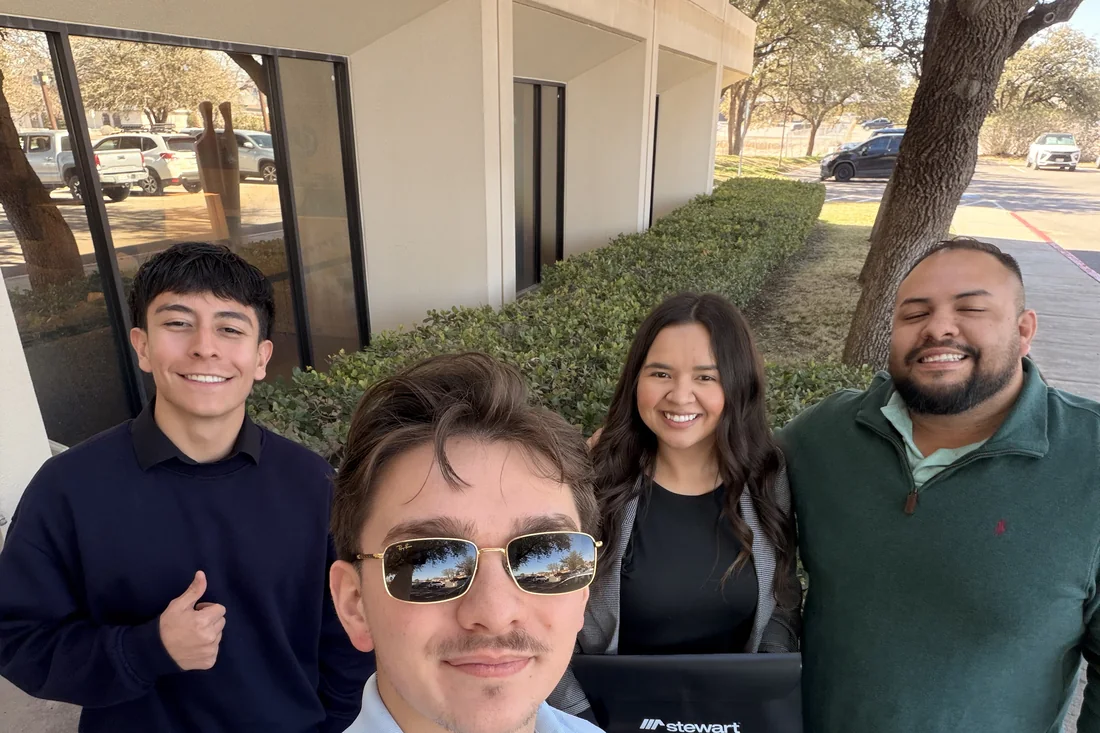 Isacc Lightbourn with clients outside after closing on their El Paso home